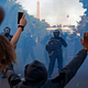 Riot police use tear gas to push back protesters outside the White House on June 1, 2020.